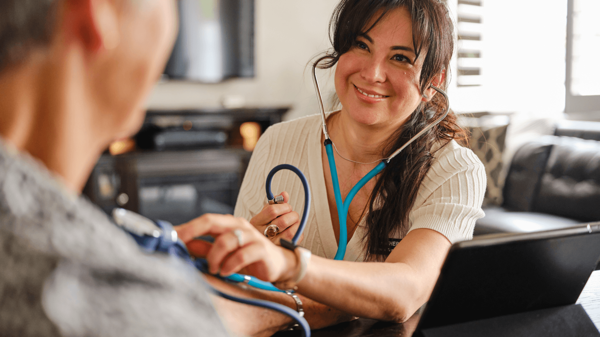 Mobile doctor providing in-home medical care during a house call visit