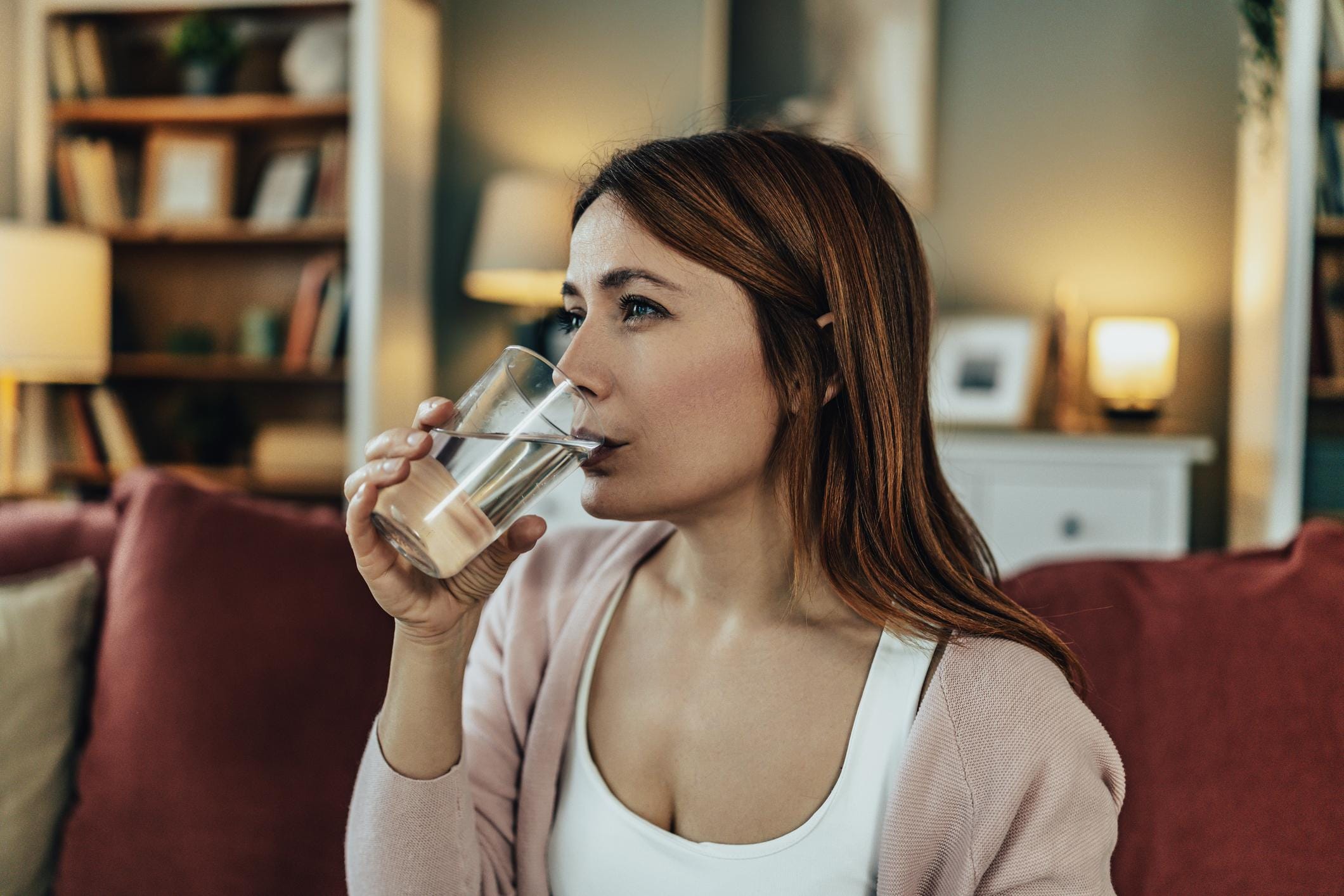 patient at home experiencing fatigue and dehydration receiving care in a comfortable living room setting